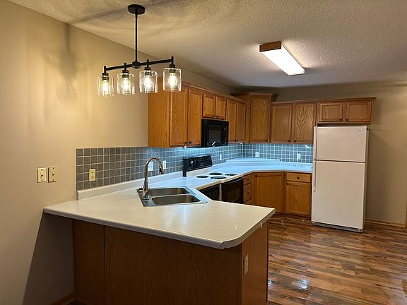 Kitchen with small bar area for stools