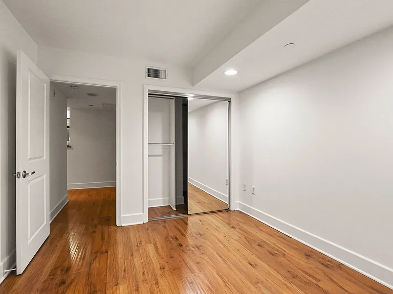 Bedroom with Mirrored Closet