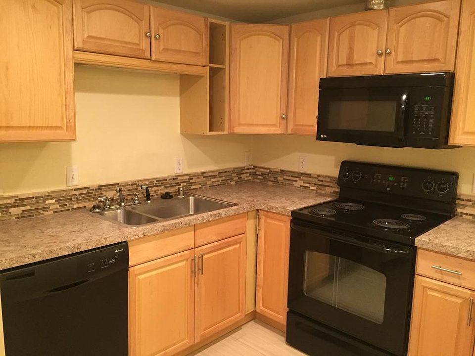 Newly remodeled kitchen with range, microwave, and dishwasher. All plumbing in the basement is new.