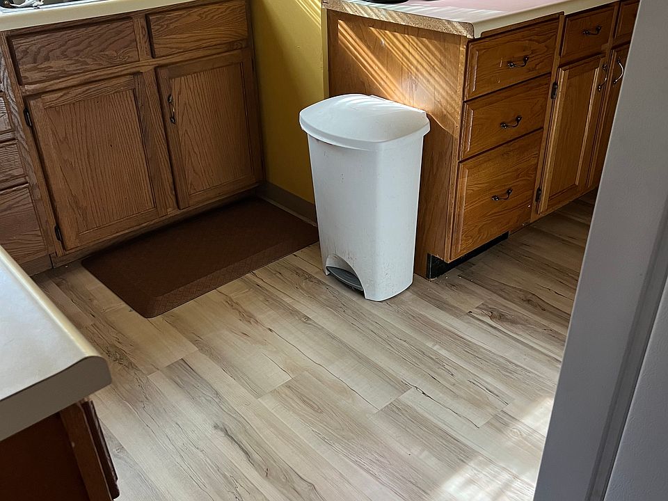 Kitchen has new flooring and was recently painted gray