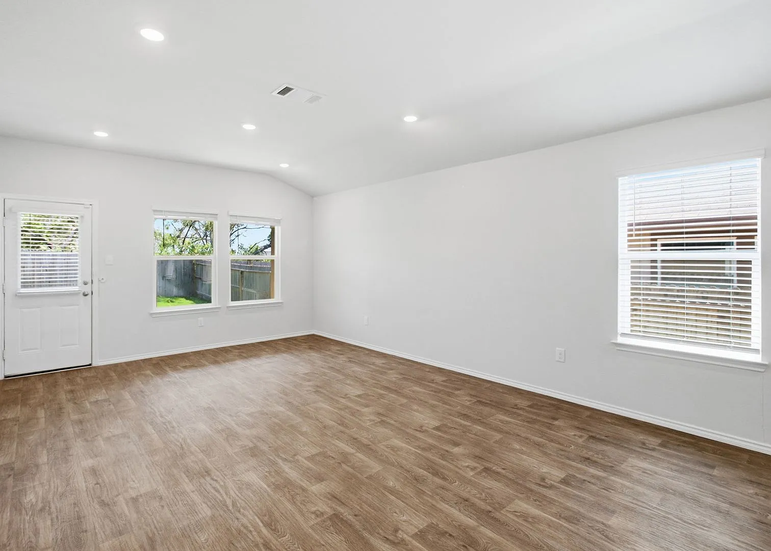 Open-Concept Living with Island Kitchen and Refrigerator Included — Photo 3