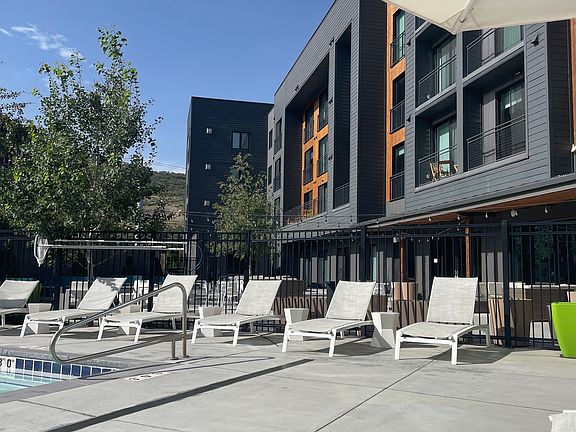 __ Lounge chairs by the pool
__ Relax in comfort on the lounge chairs next to the pool, soaking up the sun and enjoying the scenic mountain views. The perfect spot to unwind after a day of outdoor activities!