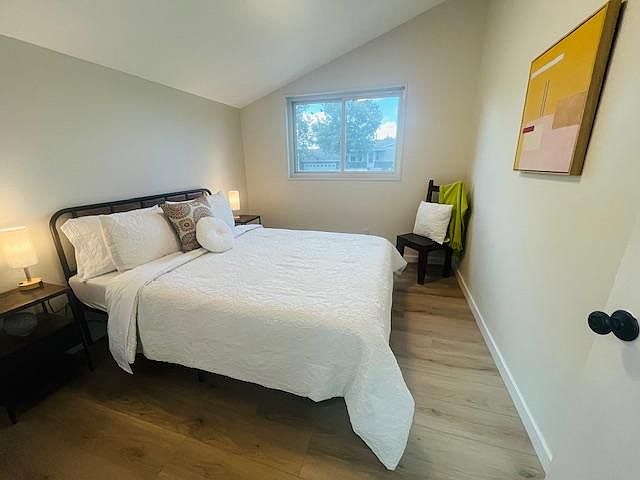 Queen bed with foam mattress and bedding included.