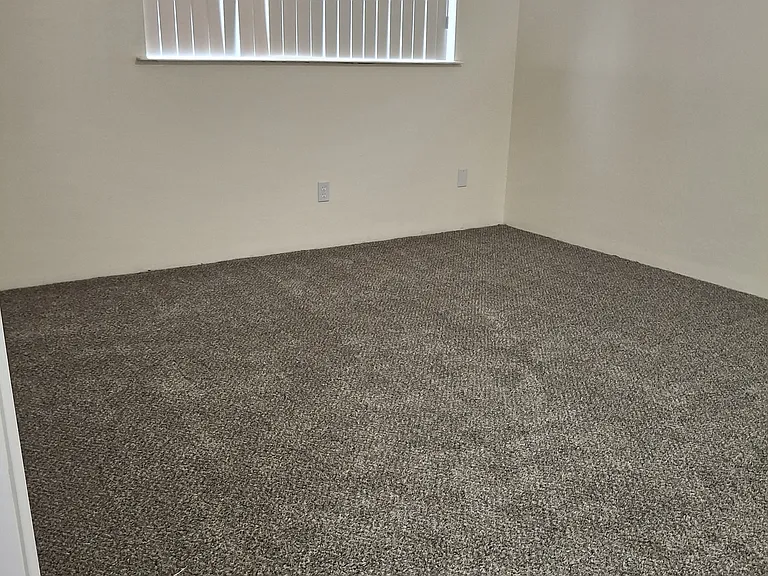 Primary bedroom is larger than it appears in the photo