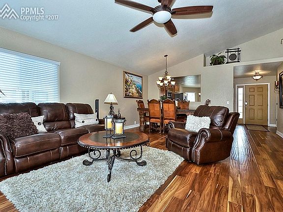 Living-room and Dining-room with Beautiful Hardwood floors and Vaulted Ceilings!
