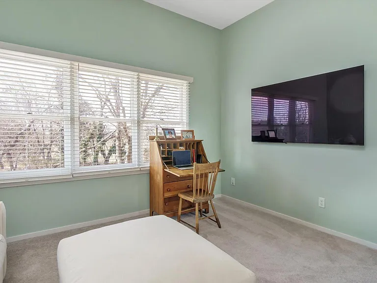 Guest Bedroom with Large 70" Smart TV.