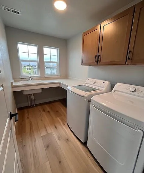 laundry room with high capacity W/D and sink!