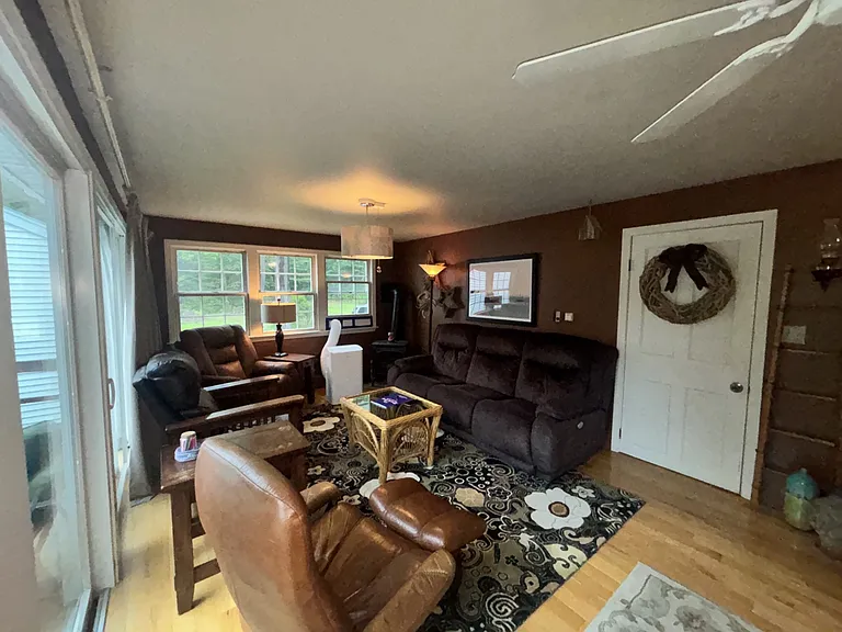Sitting area, with slider doors onto the back deck and access to garage.