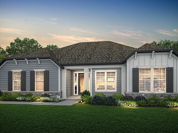 The gorgeous Albany plan has a charming exterior and lush front yard landscaping.