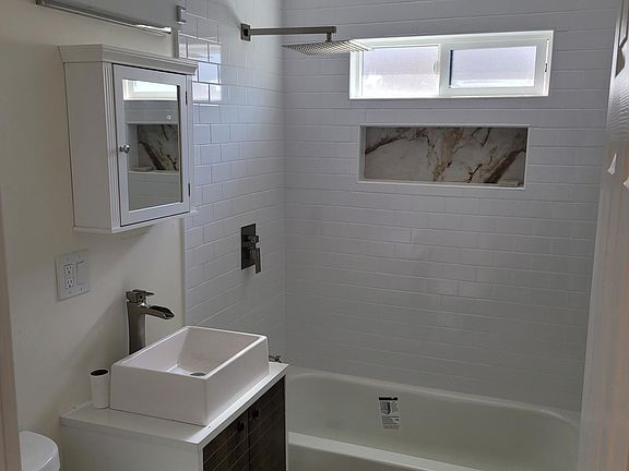 Bathroom has ALL NEW fixtures, paint, tile and flooring.