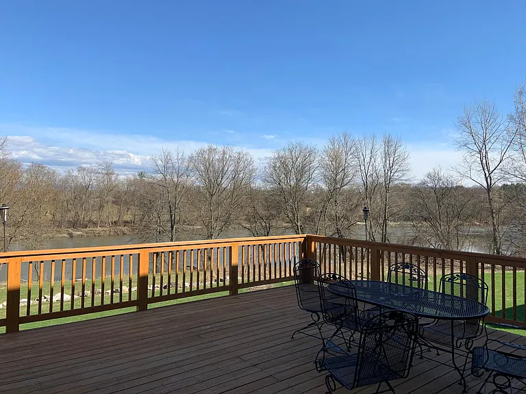 Expansive back deck overlooking the Winooski River.