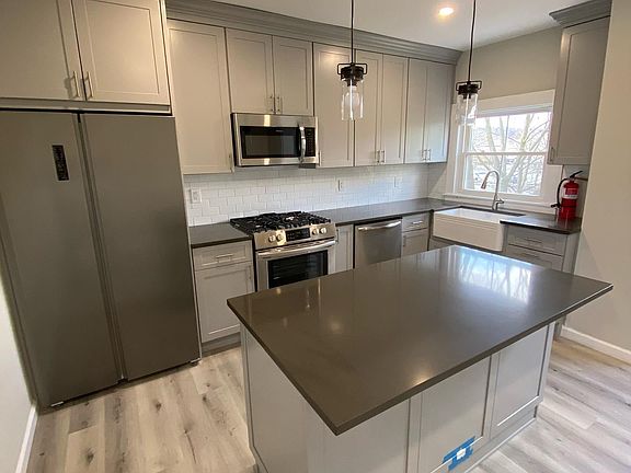 New Eat-in Kitchen with Luxury Vinyl floor, Quartz countertops and lots of Cabinet space!