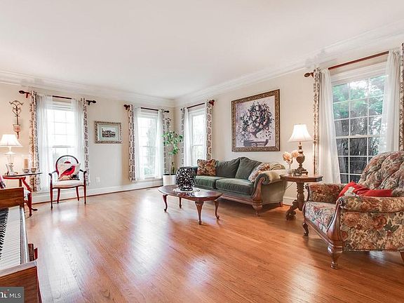 Large dining room with gleaming hardwood floors