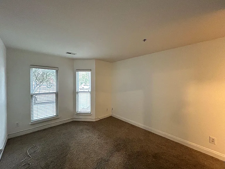 Each bedroom is generously sized, carpeted, and features a private en-suite full bathroom and a spacious closet, providing comfort and privacy.
