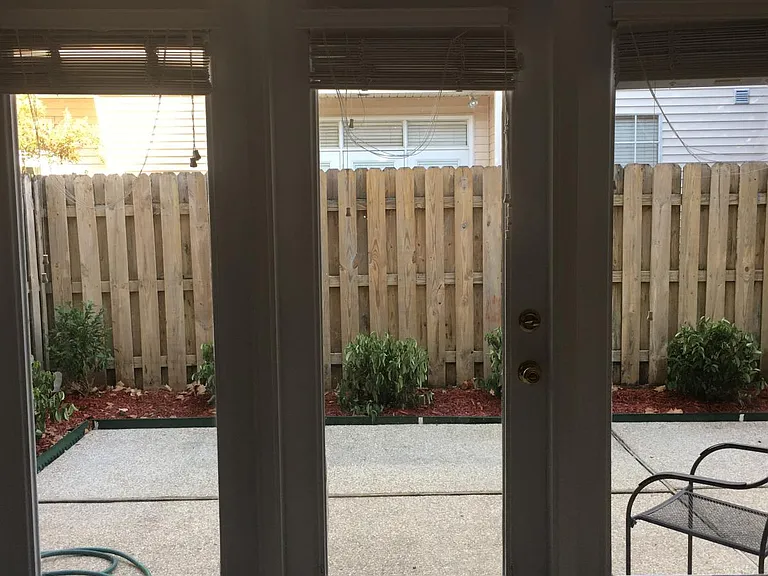 View of back patio from inside living room.