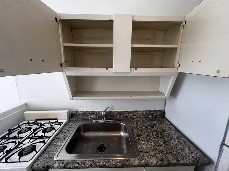 Storage over kitchen sink.
