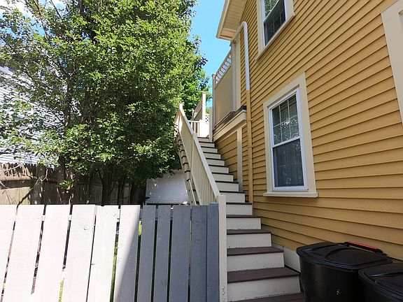 Access to the apartment is up these side stairs or through the front door.