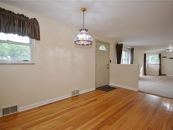 You'll immediately step onto shinning hardwood floors and notice the airy, bright atmosphere.