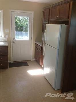 Lots of storage space with the pantry cabinet, new lighting and energy efficient exterior door.