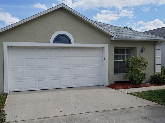 Front of house. Driveway can accommodate four cars.