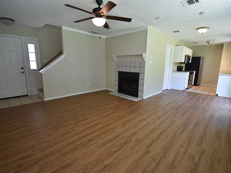 Living room with a dinning area and kitchen in the background