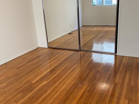 Bedroom with mirrored closet doors