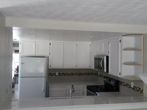 Newer Appliances, counters, backspash, cabinet doors
