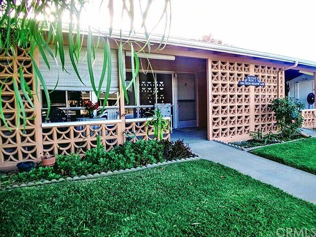 Front View Showing the patio. This is a drive-up too!
