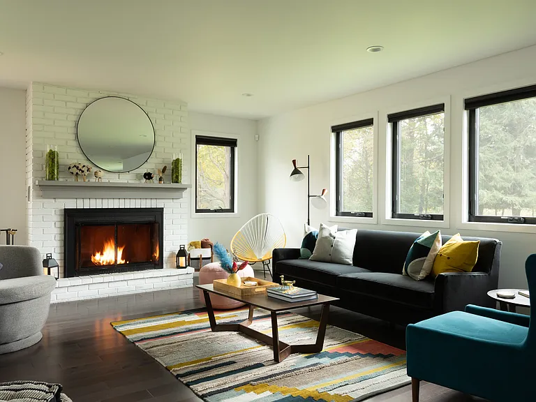 The handwoven rug, comfy seating and roaring fire make for perfect afternoons in the living room