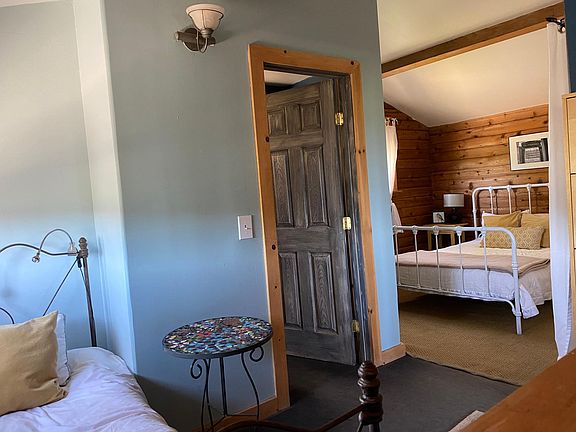 Bedroom and a half-different queen bed now, no longer with white bed frame