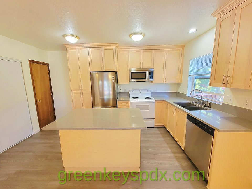 Kitchen and with island and quartz countertops