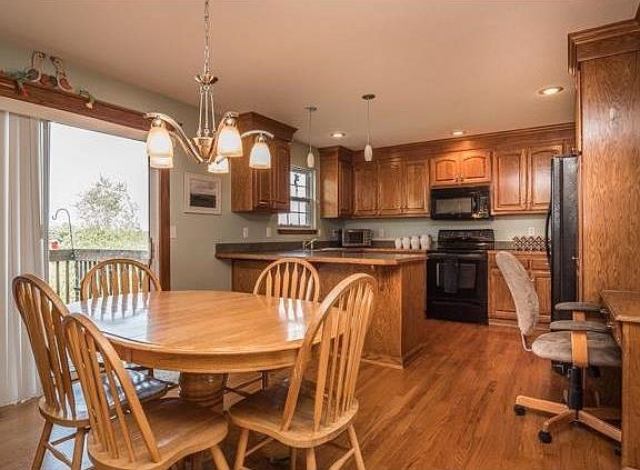 BIG kitchen with loads of cabinets and prep space.   Large kitchen area to celebrate the holidays and a functional desk area.  Opens to the deck.