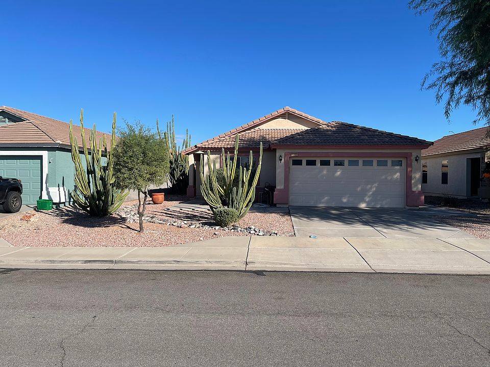 Front, desert landscaping, tile roof