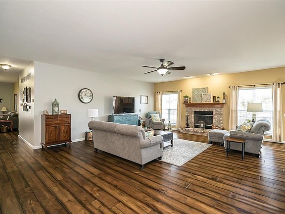 Great Room will accommodate your largest furniture! Note the fabulous wood plank flooring!