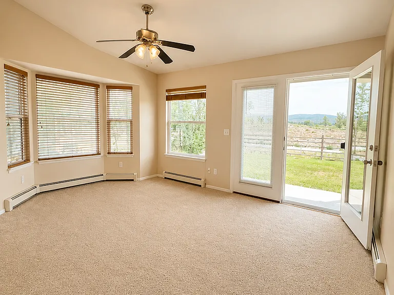 Bright, Versatile Breakfast Nook or Family Room _ Enjoy abundant natural light, golf course, mountain views.