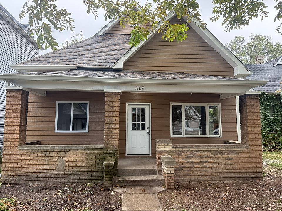 Front view of home, new roof, gutters, windows and door