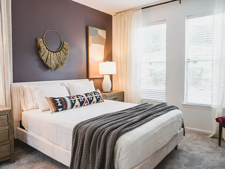 Beautiful bedroom with ample windows and natural light