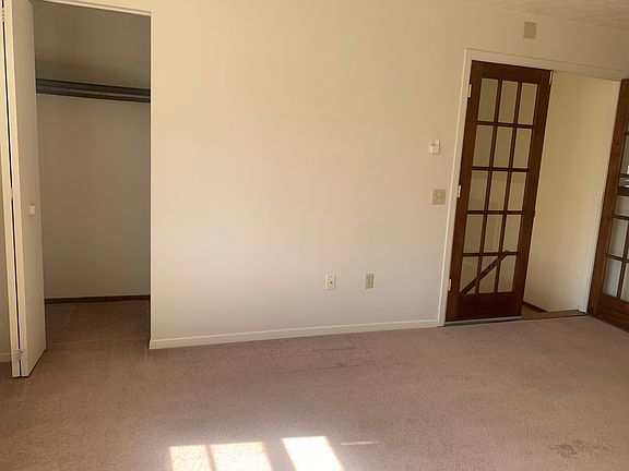 Living room, spacous closet and double door entry