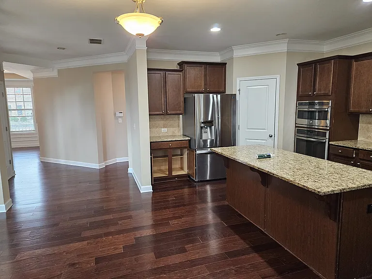 View from Sunroom to kitchen and dining area