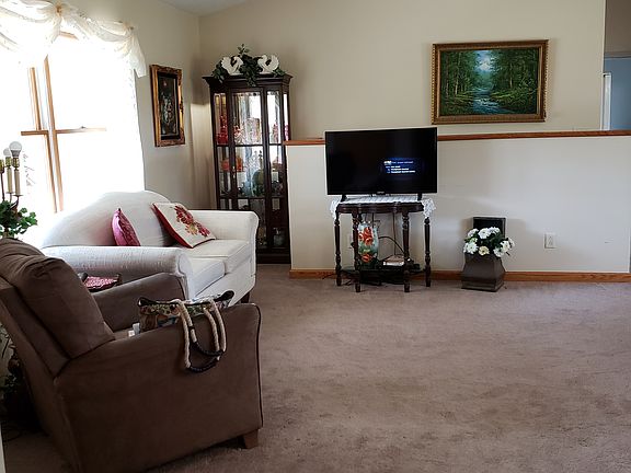 Living room. 1/2 wall is stairs
