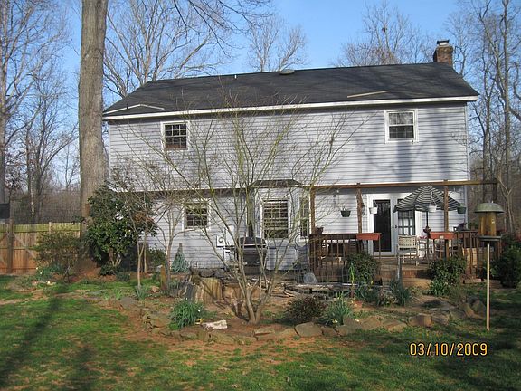 Back of home, deck, pond