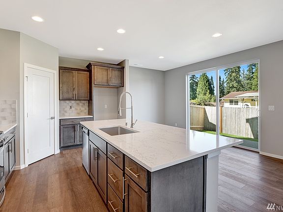 photos of 2581 plan from another community.  Colors and finishes will vary. Pendant lights not available at evergreen view