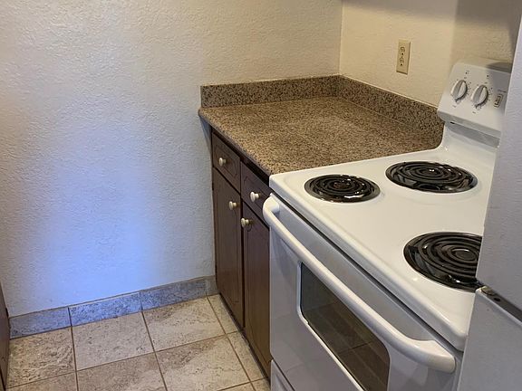 Granite counter tops, tile floors, electric stove