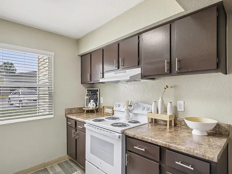 One bedroom kitchen with multiple cabinets and drawers.