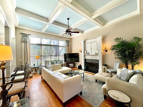 Family room w/12' coffered ceiling & gas fireplace