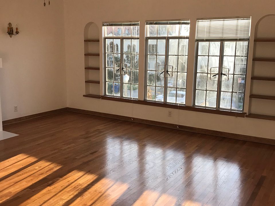 Front windows with view of Mansfield Ave and original 1926 built in wooden wall shelving.