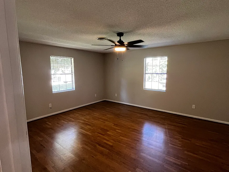 first bedroom with an en suite 1/2 bath