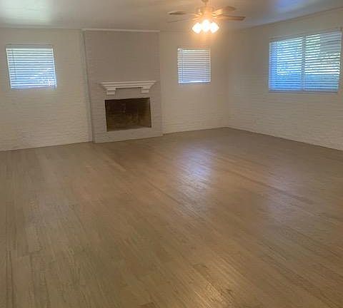 HUGE Family Room has lots of windows and a Fireplace AND hardwood floors!
