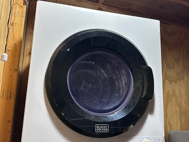 Private clothes dryer located in shared shed