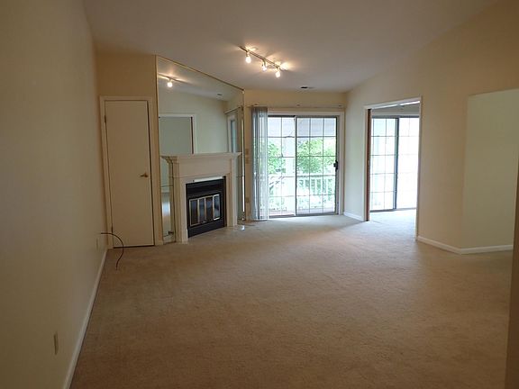 Living room with a look toward the balcony. Gas fireplace.